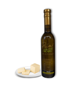 A 375ml bottle of Butter Olive Oil with a plate of butter.
