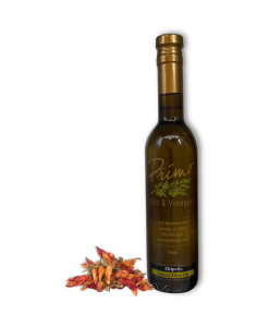 A 375ml bottle of Chipotle Olive Oil with chipotle chillies.