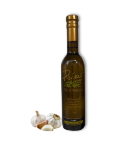 A 375ml bottle of Garlic Olive Oil with garlic cloves.