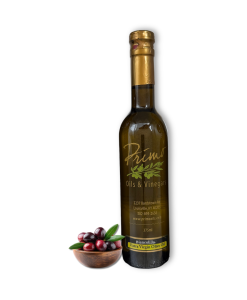 A 375 ml bottle of Biancolilla Extra Virgin Olive Oil with a bowl of olives grown in Italy.