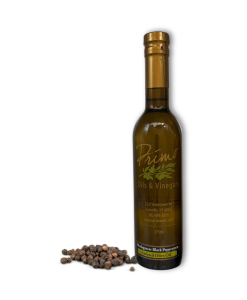 A 375ml bottle of Madagascar Black Pepper Olive Oil with black peppercorns.