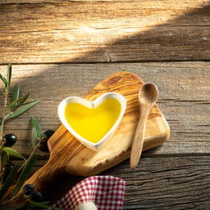 a picture of a heart-shaped bowl with olive oil 