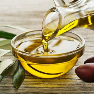 a picture of pouring an olive oil a small bowl