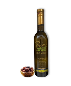 A 375ml bottle of Picual Extra Olive Oil with a bowl of olives grown in Chile.