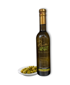 A 375ml bottle of Lentrisca Extra Olive Oil with a plate of olives grown in Portugal.