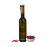 A 375ml bottle of Gochujang Olive Oil with bowl of spicy umami and red chili peppers.